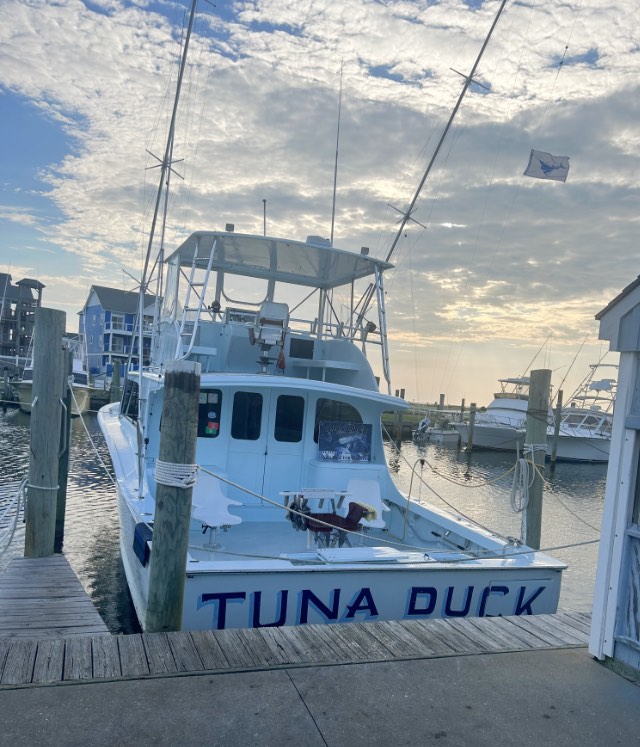 Tuna Duck fishing boat at the dock flying a sailfish release flag