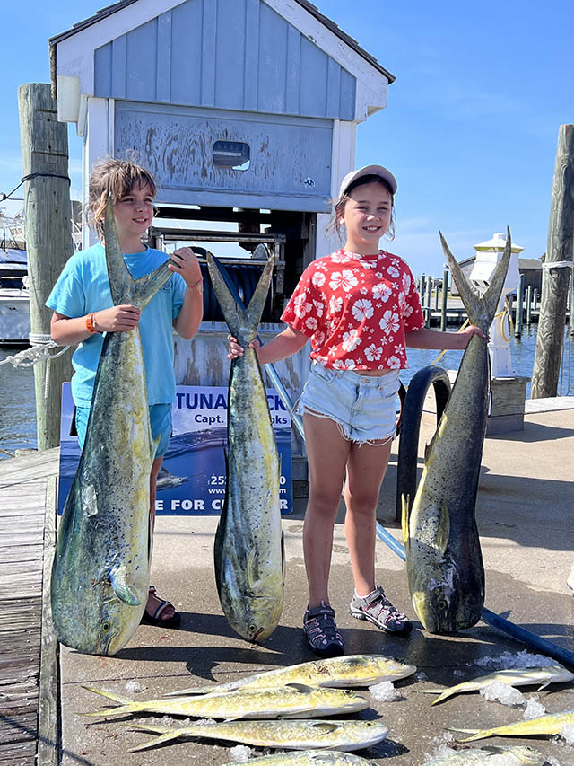 Girls pose with their mahi catch