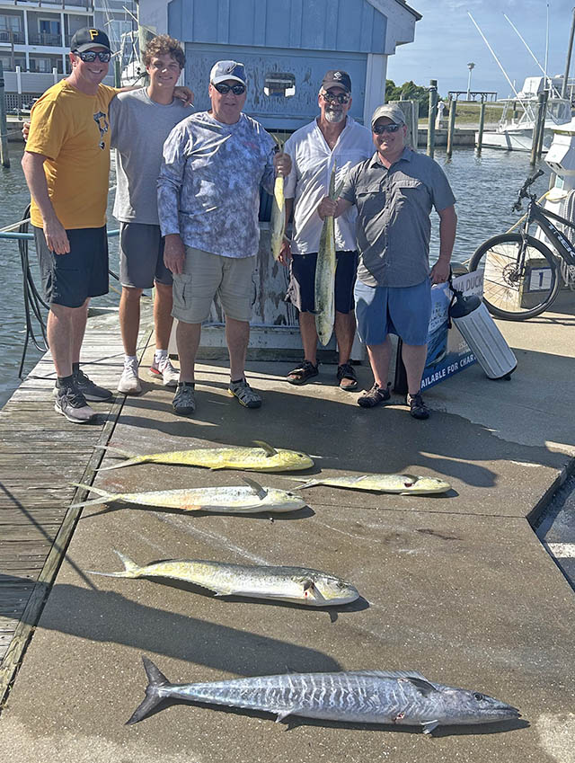 Gulf Stream anglers pose on the dock at Hatteras NC with their catch of dolphin and a wahoo